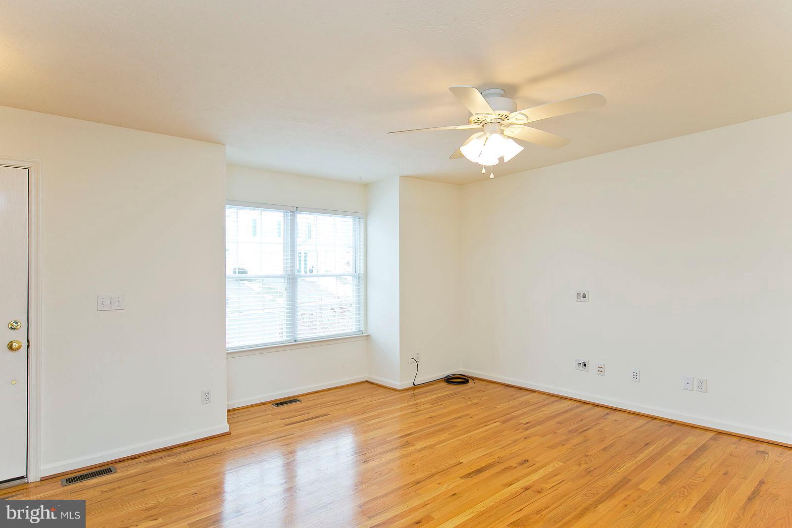 100 Scirocco Lane Winchester, VA 22602 - Photo 5 of 37 a view of a room with a ceiling fan and a window