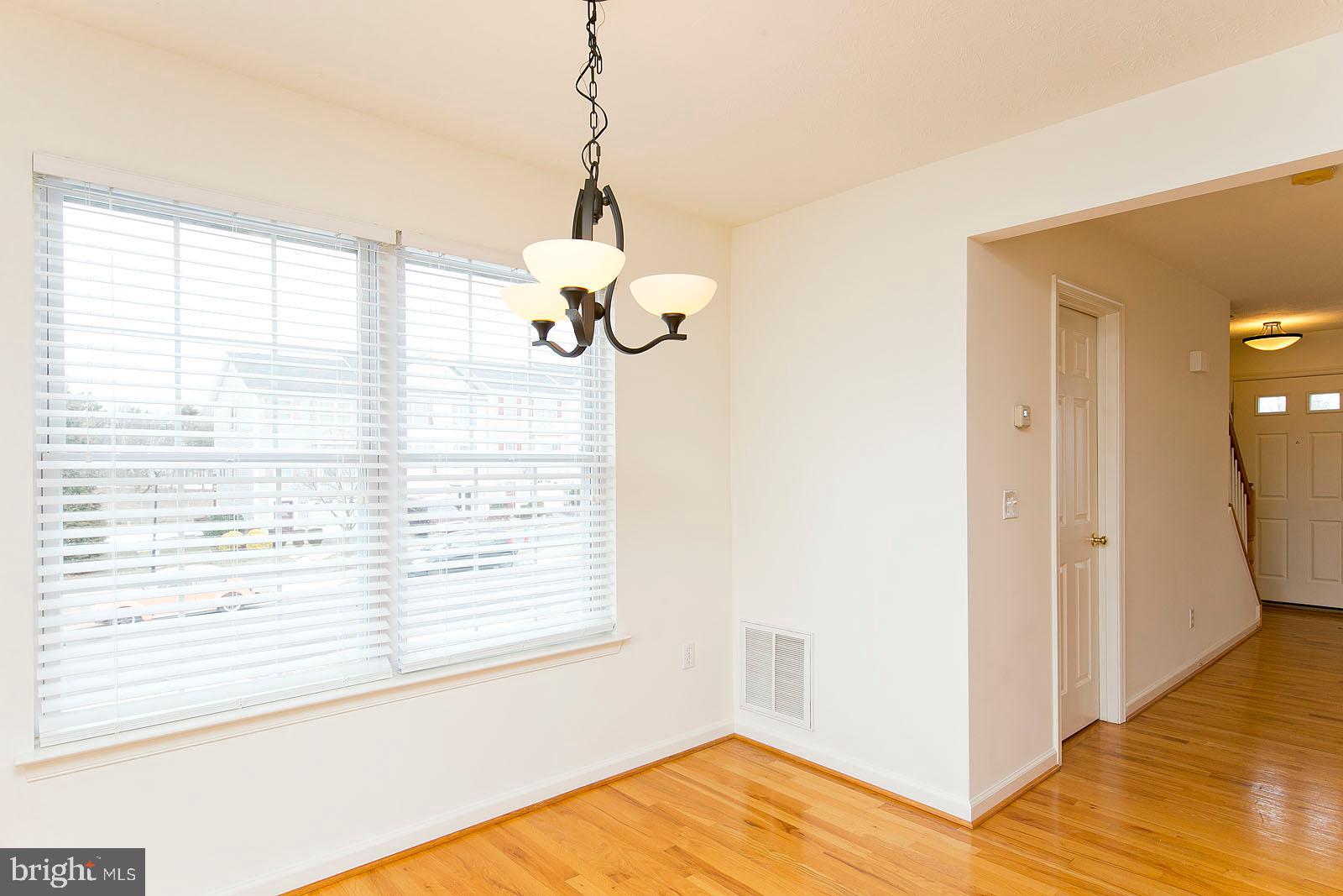 100 Scirocco Lane Winchester, VA 22602 - Photo 6 of 37 a view of a room with a window and wooden floor