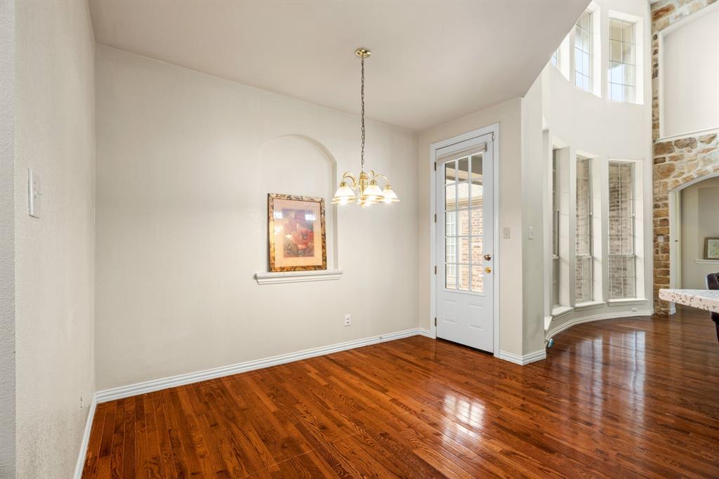 2012 Burnside Drive Allen, TX 75013 - Photo 27 of 40 a view of empty room with wooden floor and fan