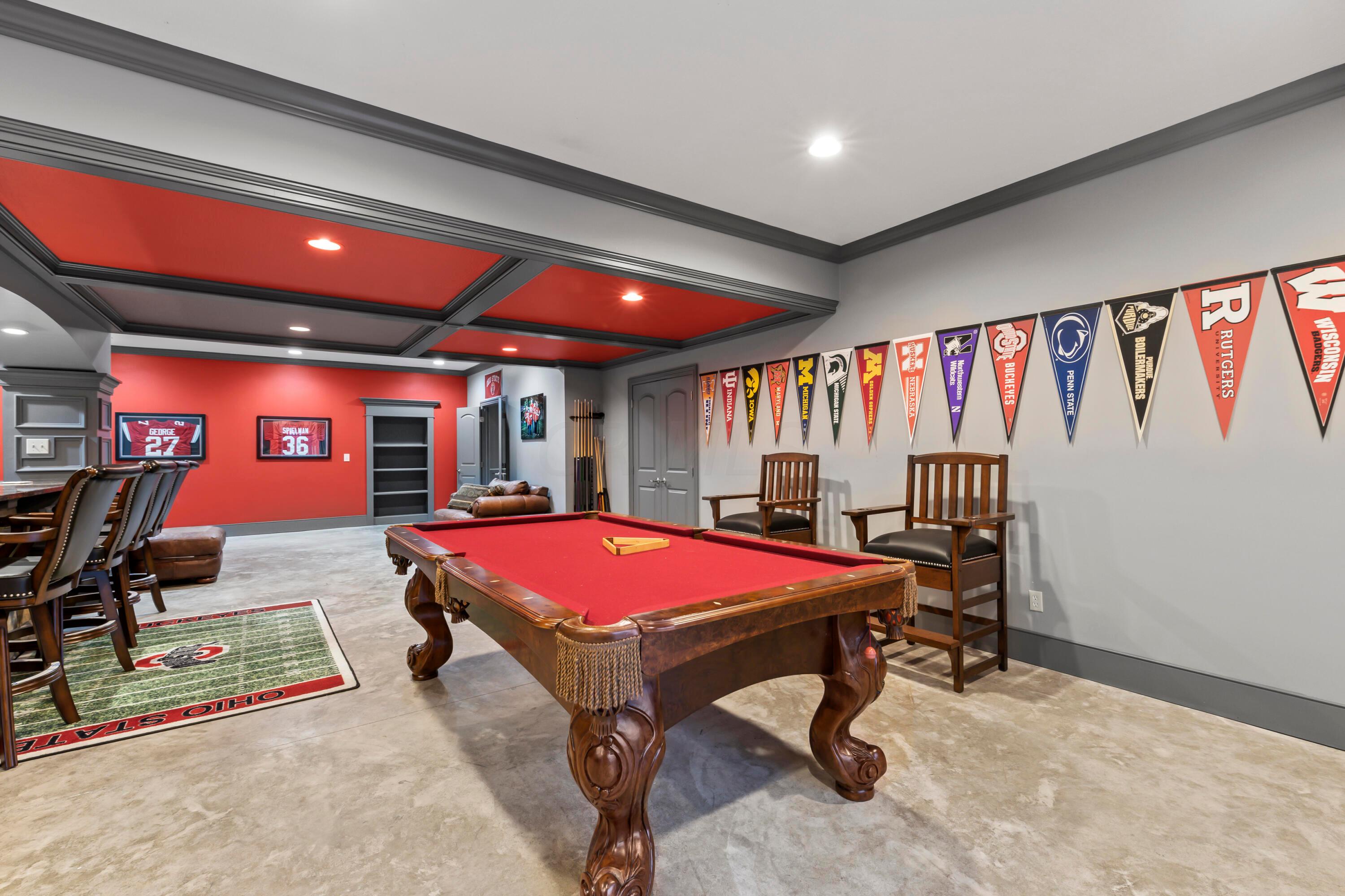6043 Dublin Road Delaware, OH 43015 - Photo 48 of 98 • Concrete floor
• Scarlet & grey painted walls
• Crown molding
• Can lighting
• Double sliding doors
to patio
