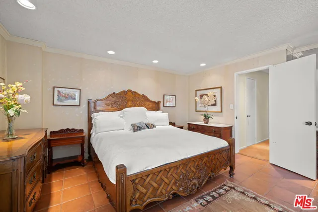 a bedroom with a bed and a table in it