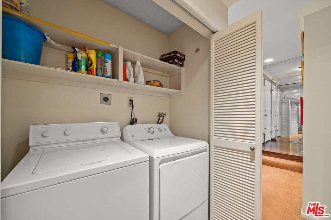 321 North Oakhurst Drive, Unit 403 Beverly Hills, CA 90210 - Photo 17 of 42 a utility room with dryer and washer