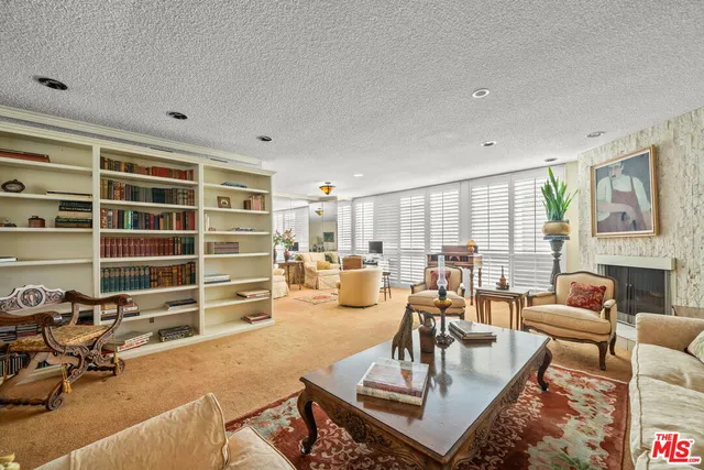 a living room with furniture or couch and a large window