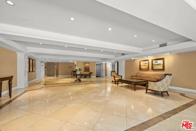 an outdoor space with swimming pool and furniture