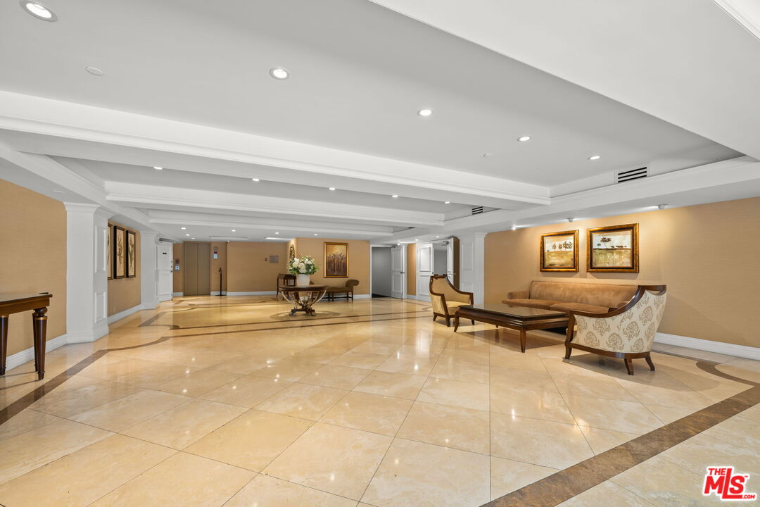 321 North Oakhurst Drive, Unit 403 Beverly Hills, CA 90210 - Photo 25 of 42 a view of a work space with furniture and windows