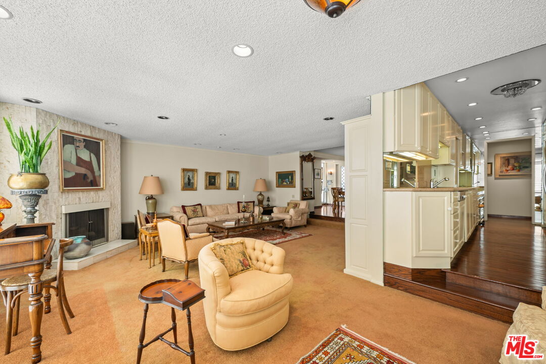 321 North Oakhurst Drive, Unit 403 Beverly Hills, CA 90210 - Photo 3 of 42 a living room with furniture and a wooden floor
