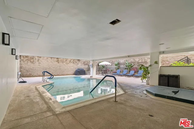 a view of parking garage with cars