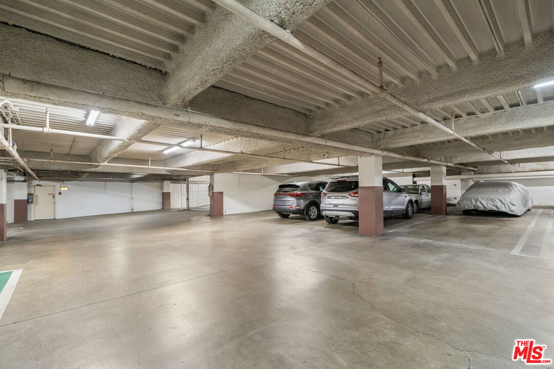 321 North Oakhurst Drive, Unit 403 Beverly Hills, CA 90210 - Photo 42 of 42 a view of parking garage with cars