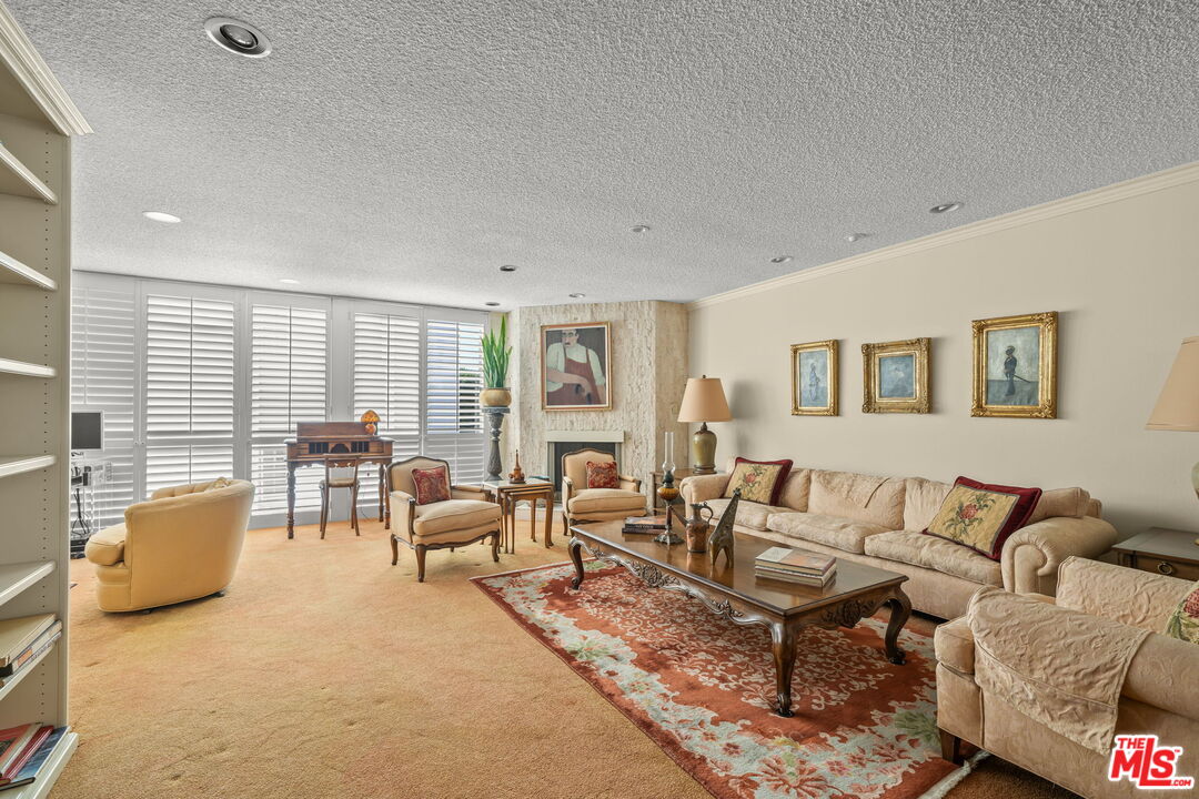 321 North Oakhurst Drive, Unit 403 Beverly Hills, CA 90210 - Photo 6 of 42 a living room with furniture and a window