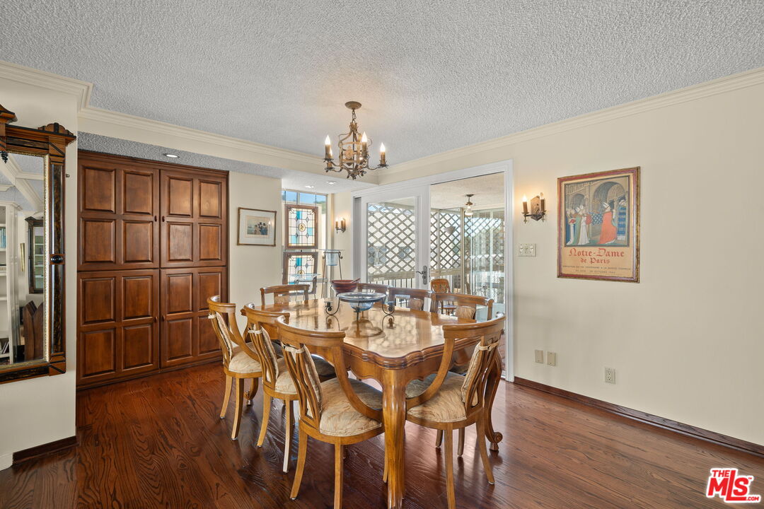321 North Oakhurst Drive, Unit 403 Beverly Hills, CA 90210 - Photo 7 of 42 a view of a dining room with furniture window and wooden floor