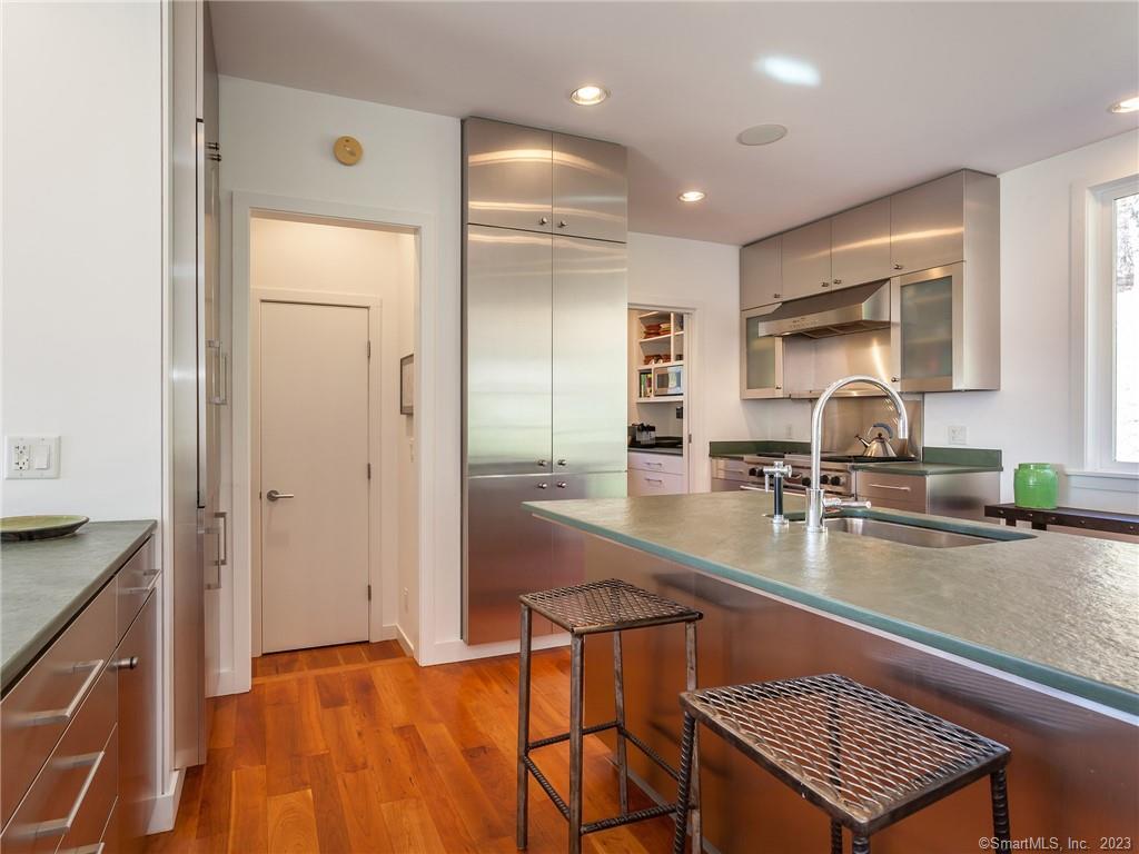 151 Treasure Hill Road Kent, CT 06785 - Photo 13 of 25 a kitchen with a sink appliances and cabinets