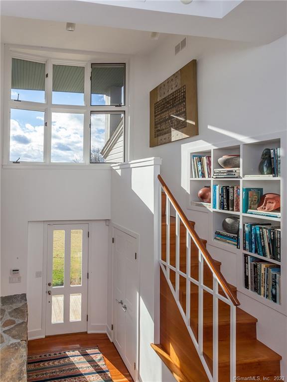 151 Treasure Hill Road Kent, CT 06785 - Photo 14 of 25 a view of an entryway with wooden floor and windows