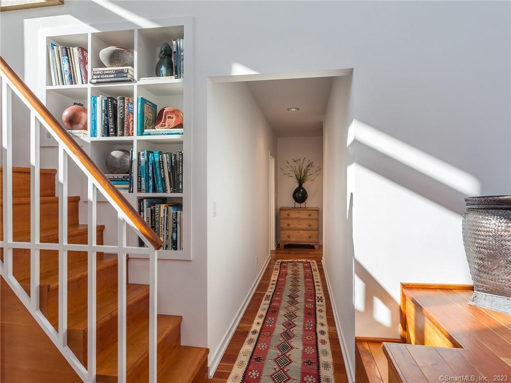 151 Treasure Hill Road Kent, CT 06785 - Photo 15 of 25 a view of a hallway with wooden floor and staircase