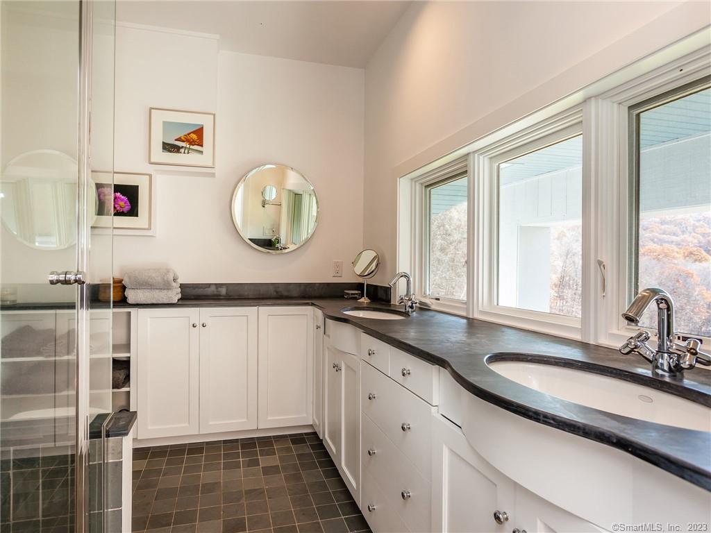 151 Treasure Hill Road Kent, CT 06785 - Photo 18 of 25 a bathroom with a granite countertop sink mirror and window