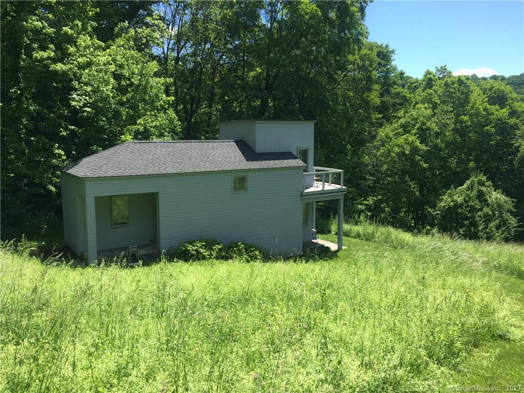 151 Treasure Hill Road Kent, CT 06785 - Photo 21 of 25 a view of a house with a yard