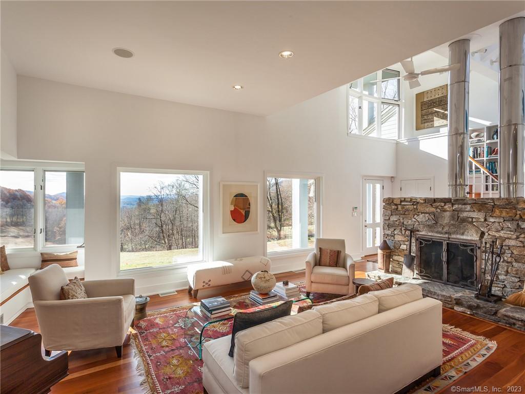 151 Treasure Hill Road Kent, CT 06785 - Photo 5 of 25 a living room with furniture and a fireplace