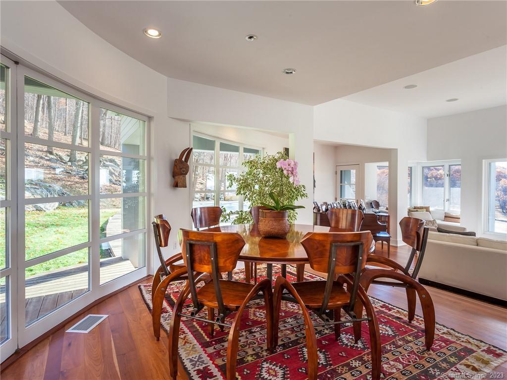 151 Treasure Hill Road Kent, CT 06785 - Photo 9 of 25 a view of a dining room with furniture window and wooden floor