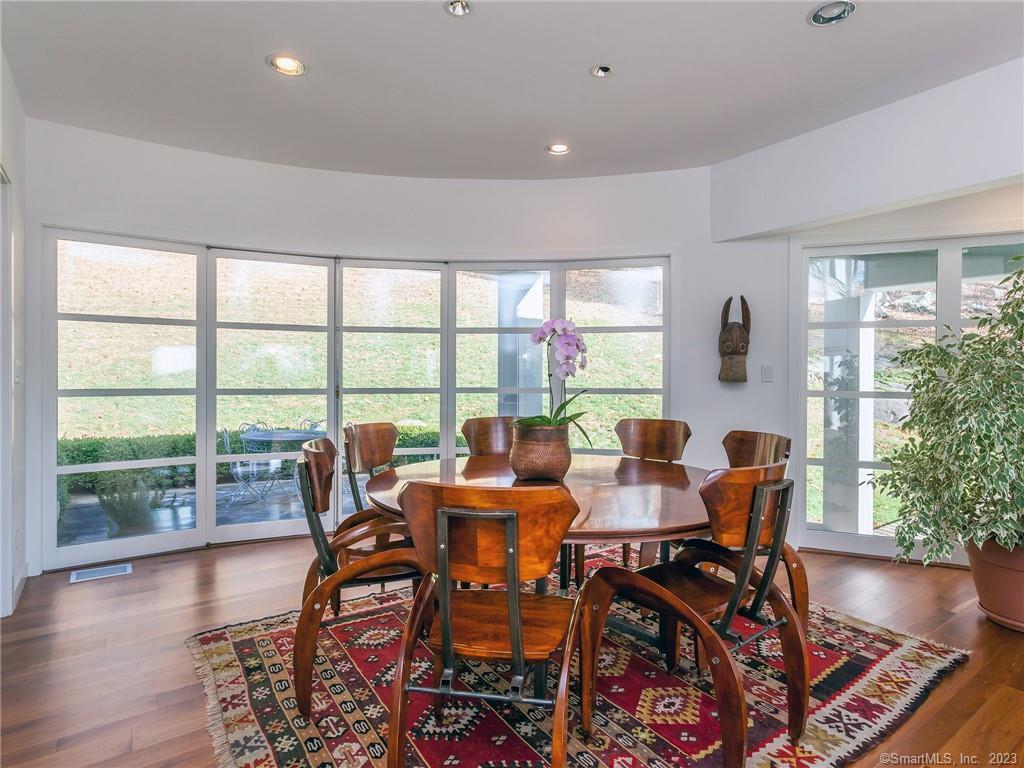 151 Treasure Hill Road Kent, CT 06785 - Photo 10 of 25 a view of a dining room with furniture and wooden floor