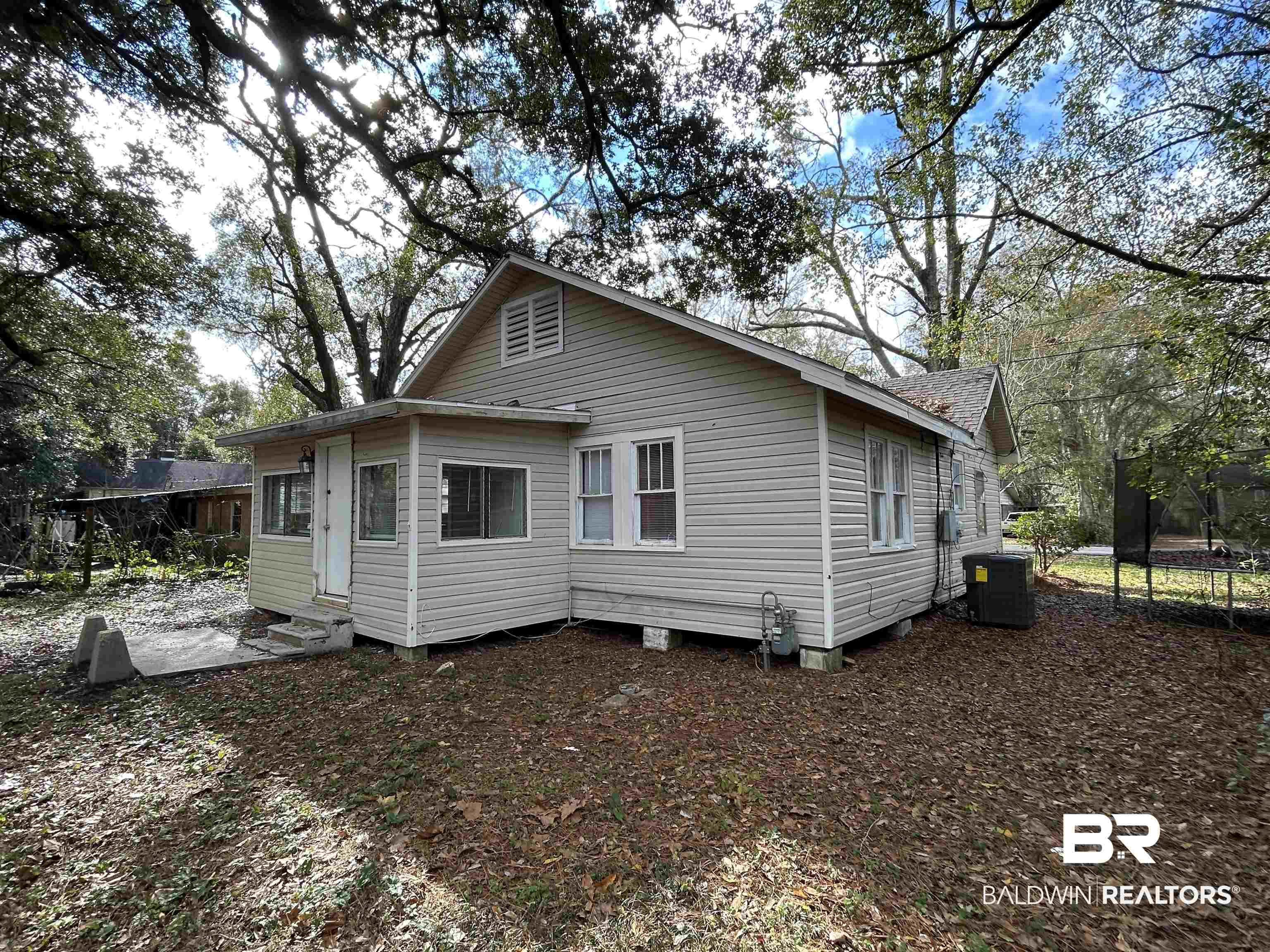 2119 Hoppin Street Mobile, AL 36605 - Photo 3 of 23 Rear view of house featuring cooling unit