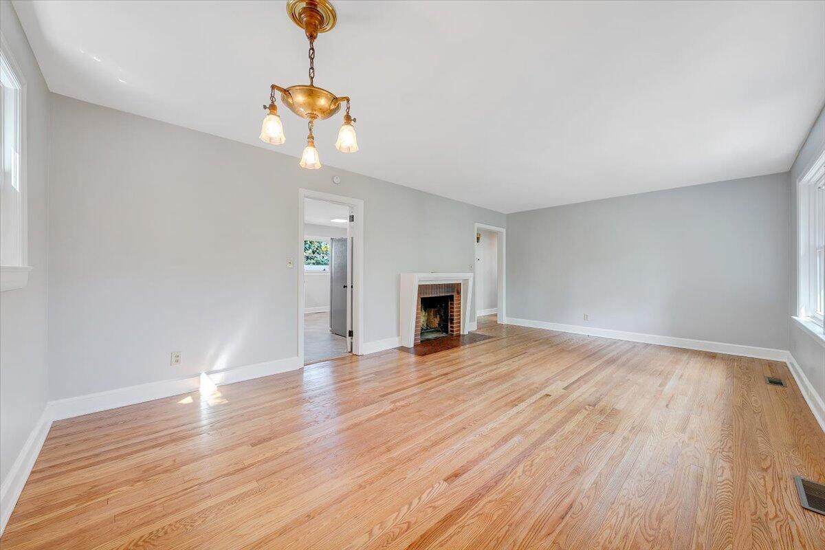 547 Dillard Road Southwest Roanoke, VA 24014 - Photo 11 of 26 a view of empty room with wooden floor and fan