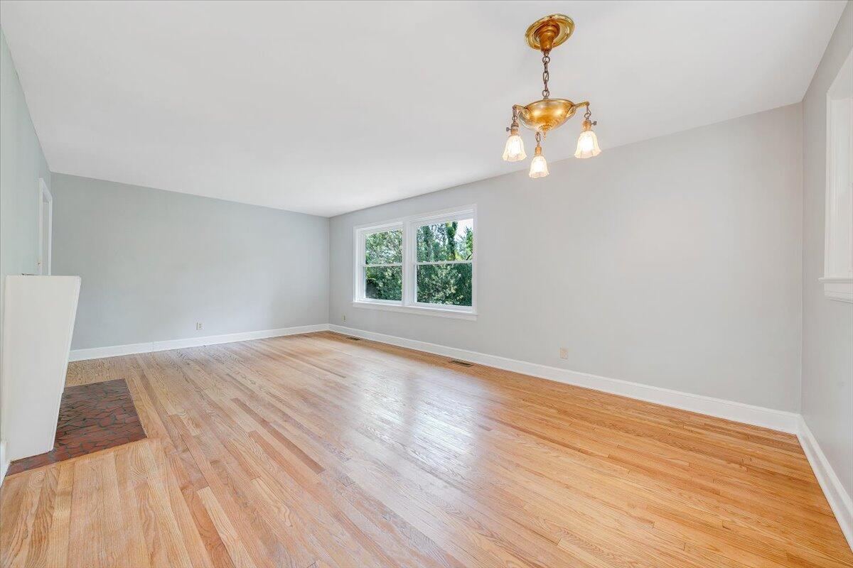 547 Dillard Road Southwest Roanoke, VA 24014 - Photo 12 of 26 a view of empty room with wooden floor and fan