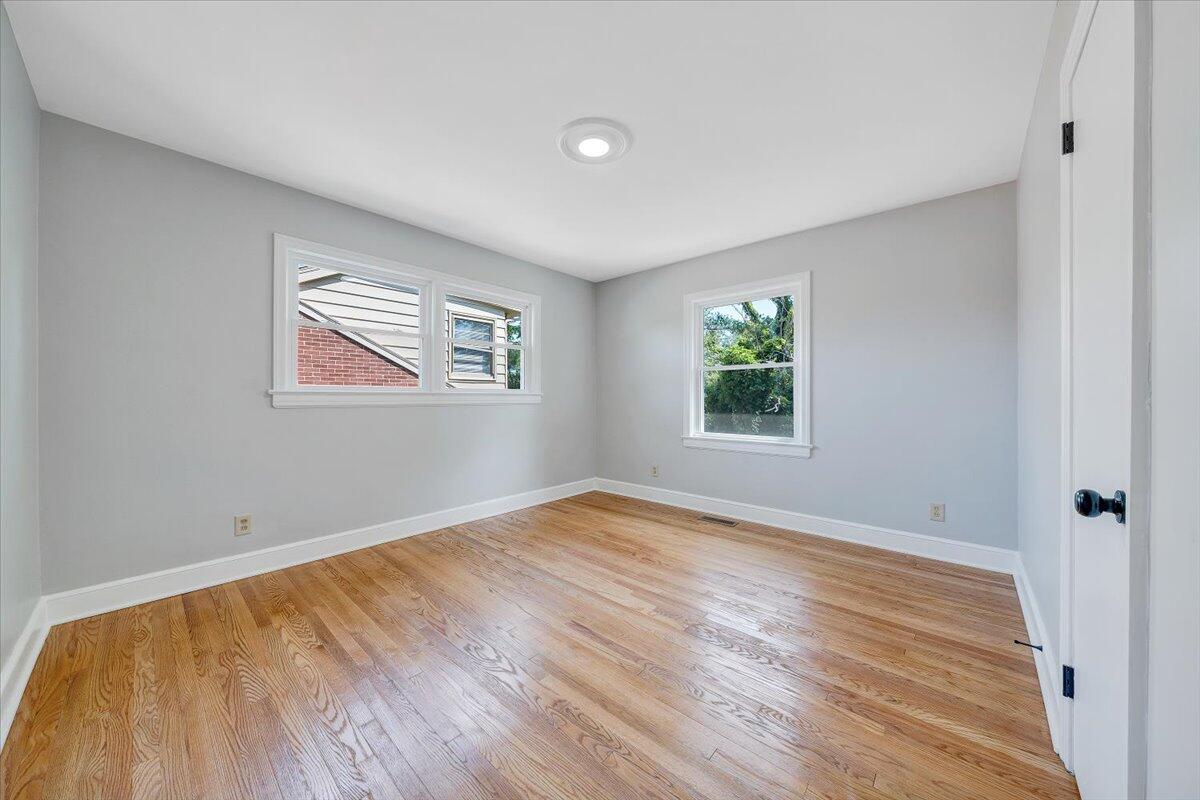547 Dillard Road Southwest Roanoke, VA 24014 - Photo 15 of 26 a view of empty room with wooden floor and fan