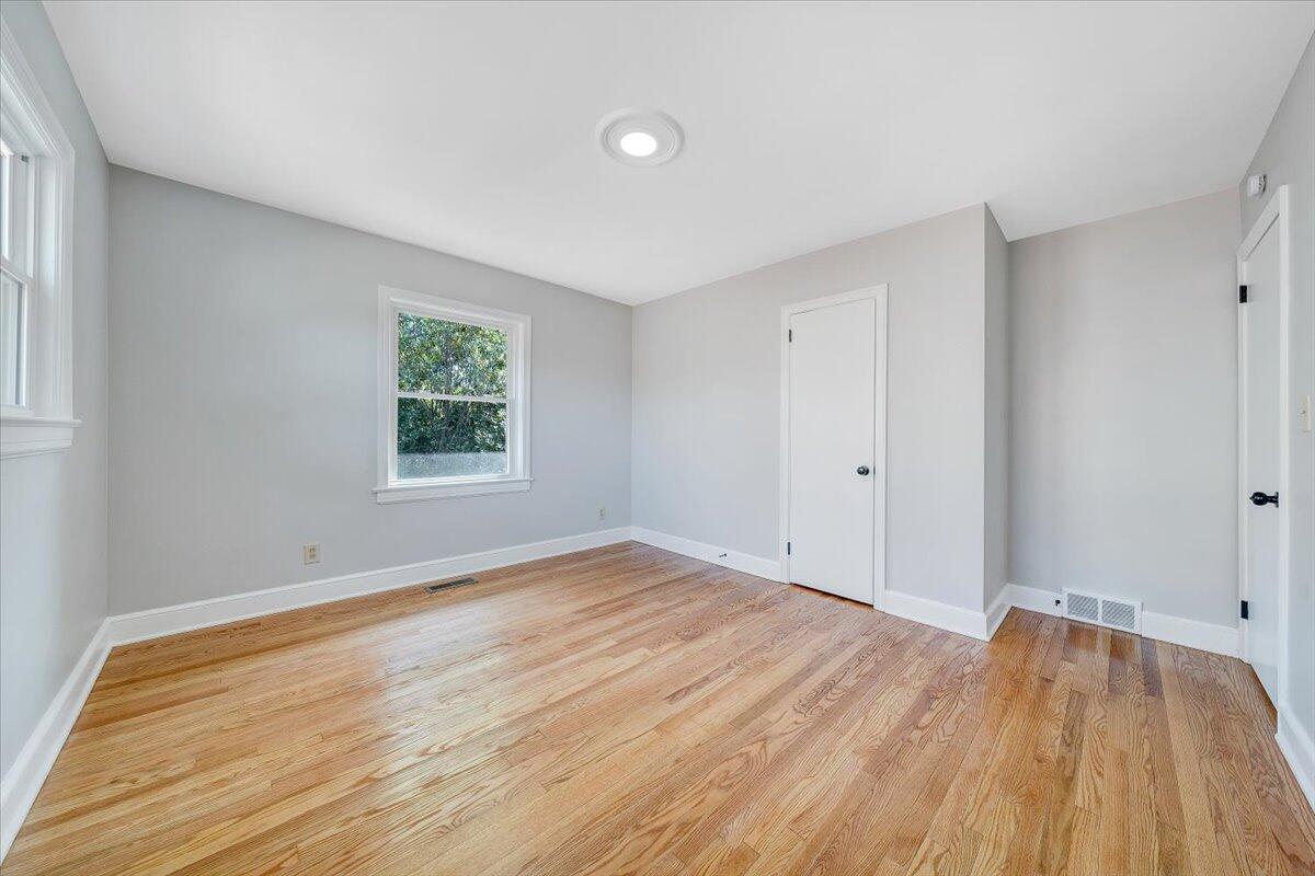547 Dillard Road Southwest Roanoke, VA 24014 - Photo 16 of 26 a view of empty room with wooden floor and fan