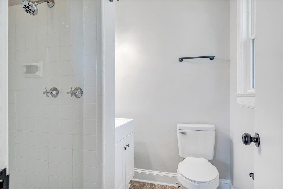 547 Dillard Road Southwest Roanoke, VA 24014 - Photo 19 of 26 a white toilet sitting next to a bathroom sink