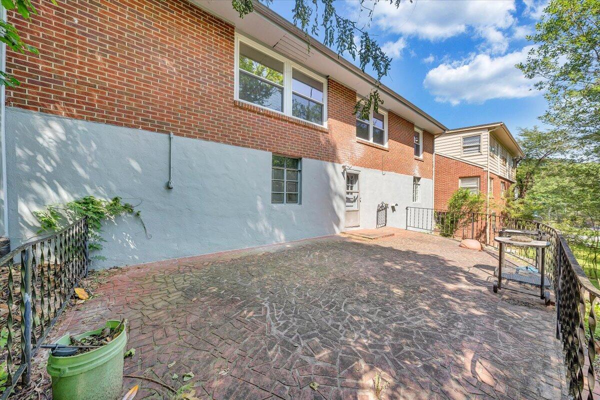547 Dillard Road Southwest Roanoke, VA 24014 - Photo 24 of 26 a view of a house with a yard and a garage