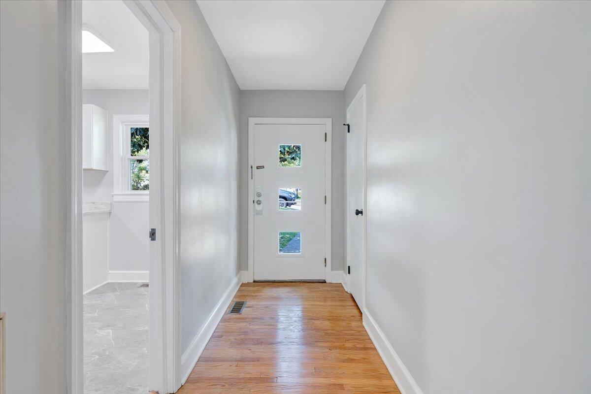 547 Dillard Road Southwest Roanoke, VA 24014 - Photo 3 of 26 a view of a hallway with wooden floor and closet