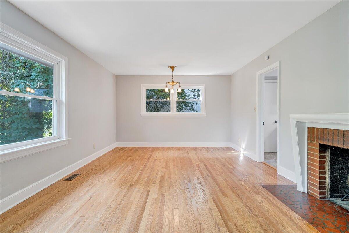 547 Dillard Road Southwest Roanoke, VA 24014 - Photo 9 of 26 wooden floor in an empty room with a window