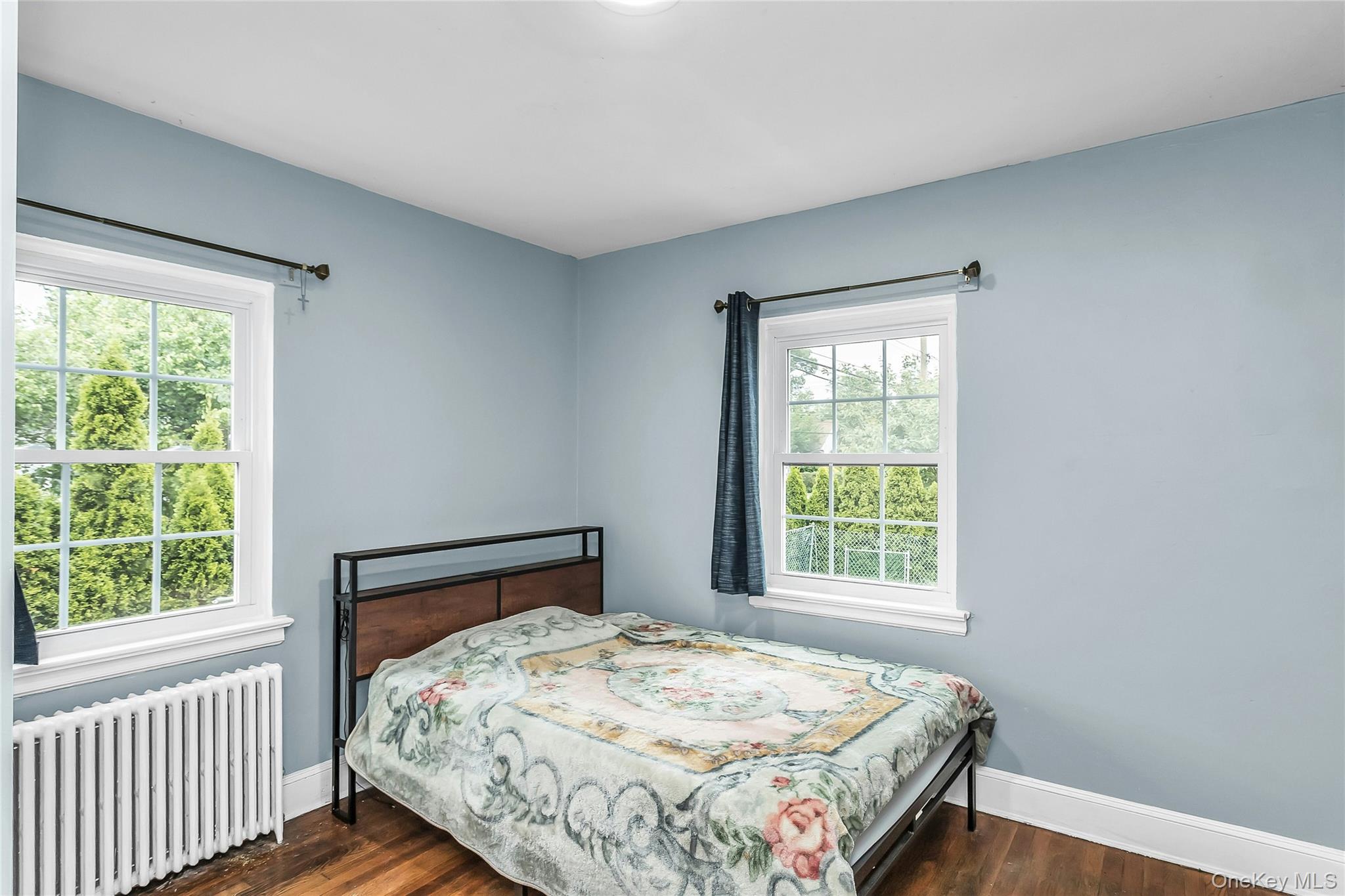 103 Union Street Valley Stream, NY 11580 - Photo 11 of 19 a bedroom with a bed and a window