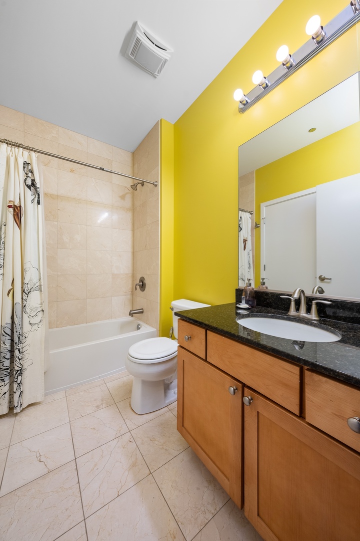520 South State Street, Unit 1722 Chicago, IL 60605 - Photo 15 of 28 a bathroom with a double vanity sink toilet and shower