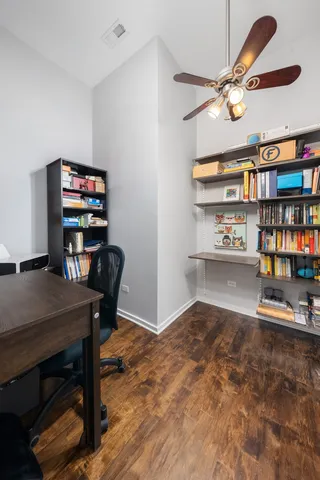 a workspace with furniture and a book shelf