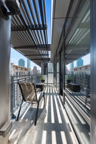 a view of a patio with a table and chairs
