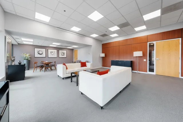 a very nice looking room with a large window and a flat screen tv