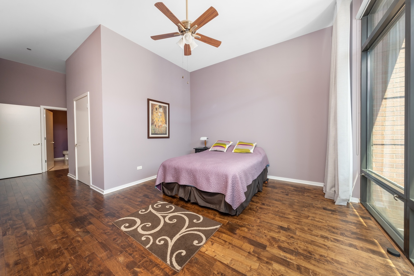 520 South State Street, Unit 1722 Chicago, IL 60605 - Photo 9 of 28 a spacious bedroom with a bed and a window