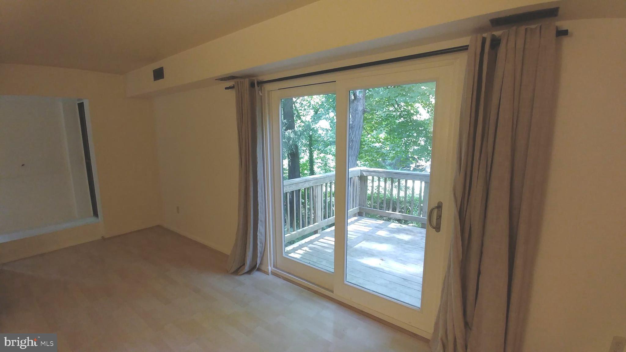 10740 Faulkner Ridge Circle Columbia, MD 21044 - Photo 10 of 26 Living room to deck