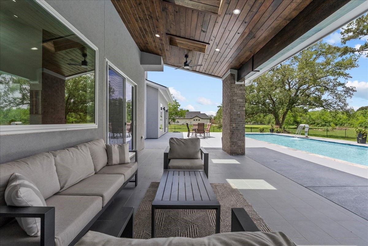 7627 Scott Avenue Manvel, TX 77578 - Photo 40 of 50 This expansive covered patio features a stunning stained-wood ceiling.