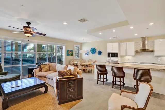 a view of a dining room with furniture wooden floor and chandelier