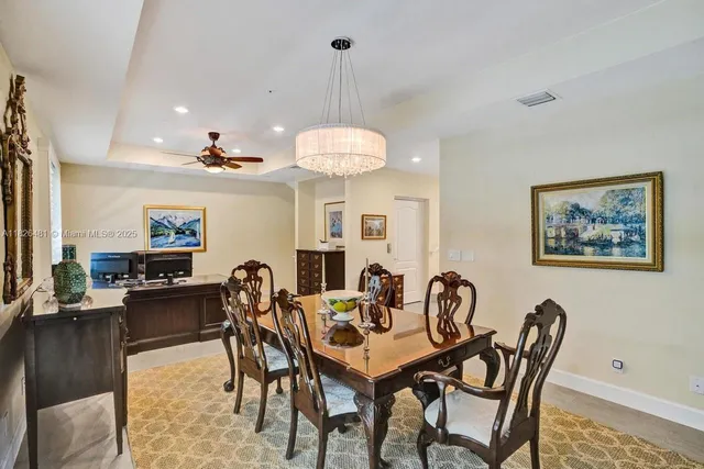 a bathroom with a tub a sink and a large mirror