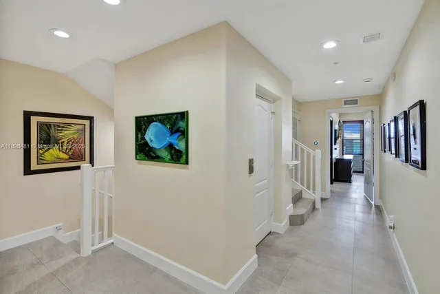 a bedroom with a bed dresser and a flat tv screen