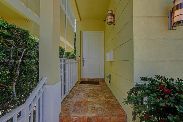 a view of a chairs and table in patio with a lake view