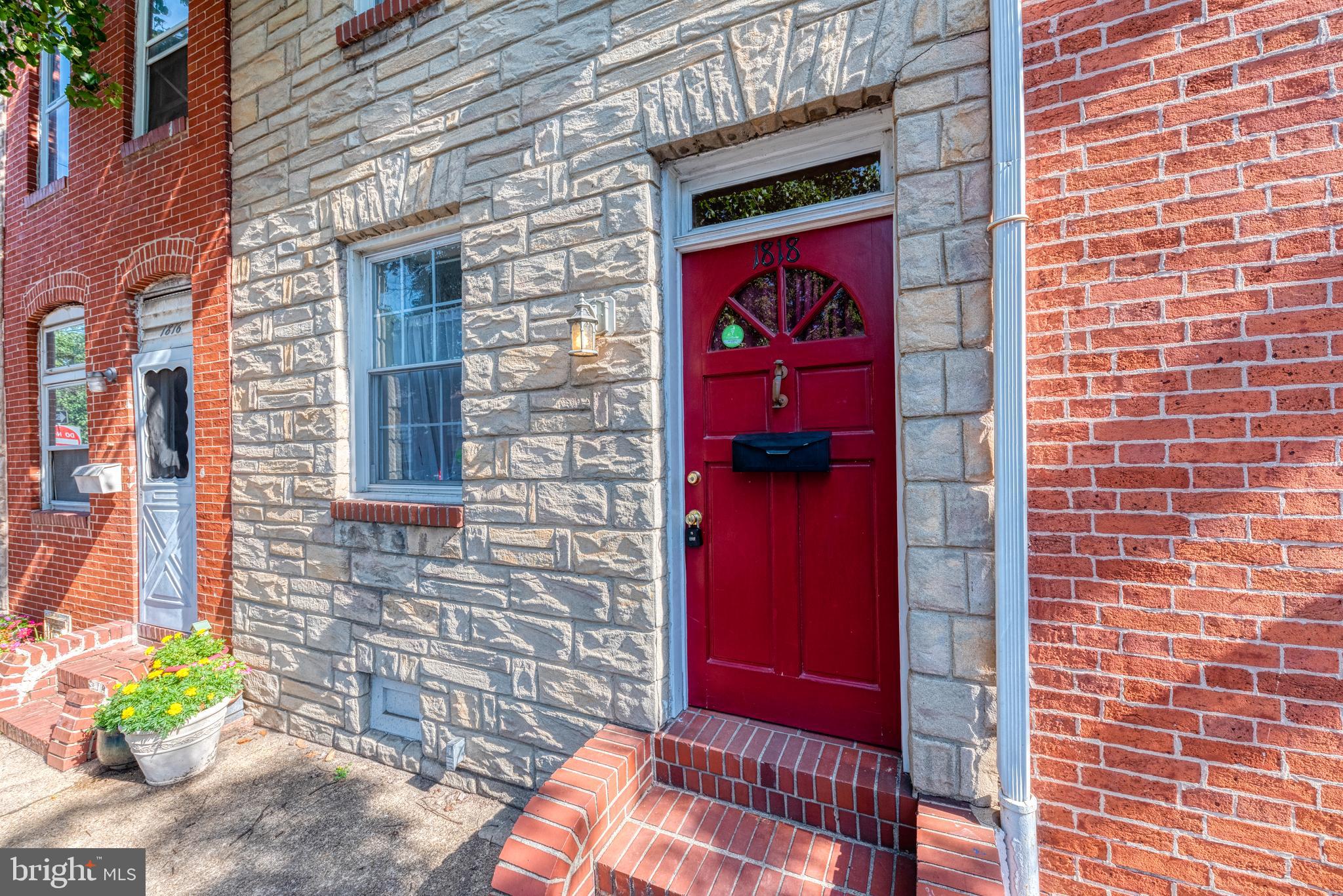 1818 Bank Street Baltimore, MD 21231 - Photo 20 of 20 a red brick building with red door