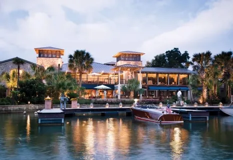 a view of a swimming pool with outdoor seating