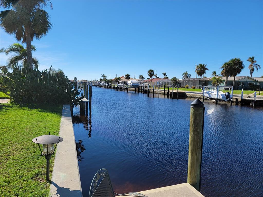 1732 Boca Raton Court Punta Gorda, FL 33950 - Photo 17 of 64 a view of a lake with houses