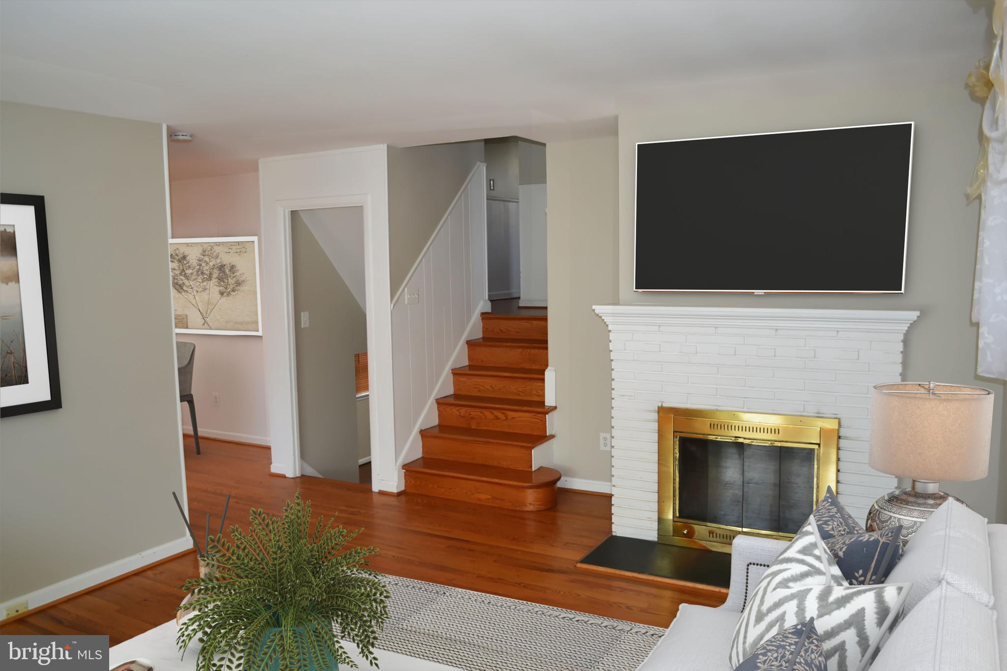 3905 Lantern Drive Silver Spring, MD 20902 - Photo 5 of 24 A cozy fireplace and hardwood floors