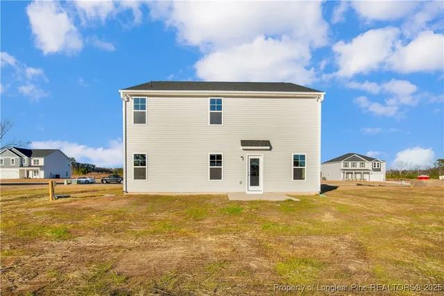 a view of a house with a big yard