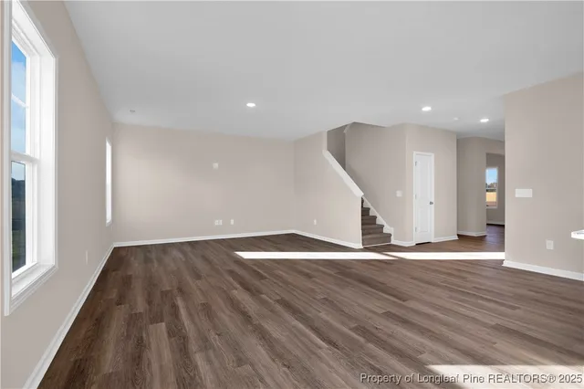 a view of a kitchen with wooden floor