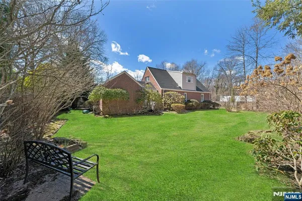 a view of a house with a back yard